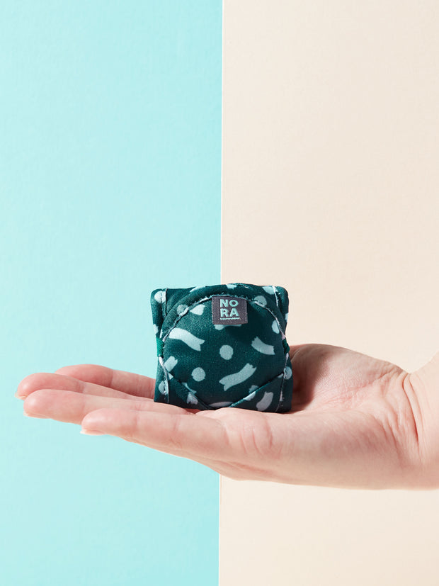 Celeste green liner folded in hand