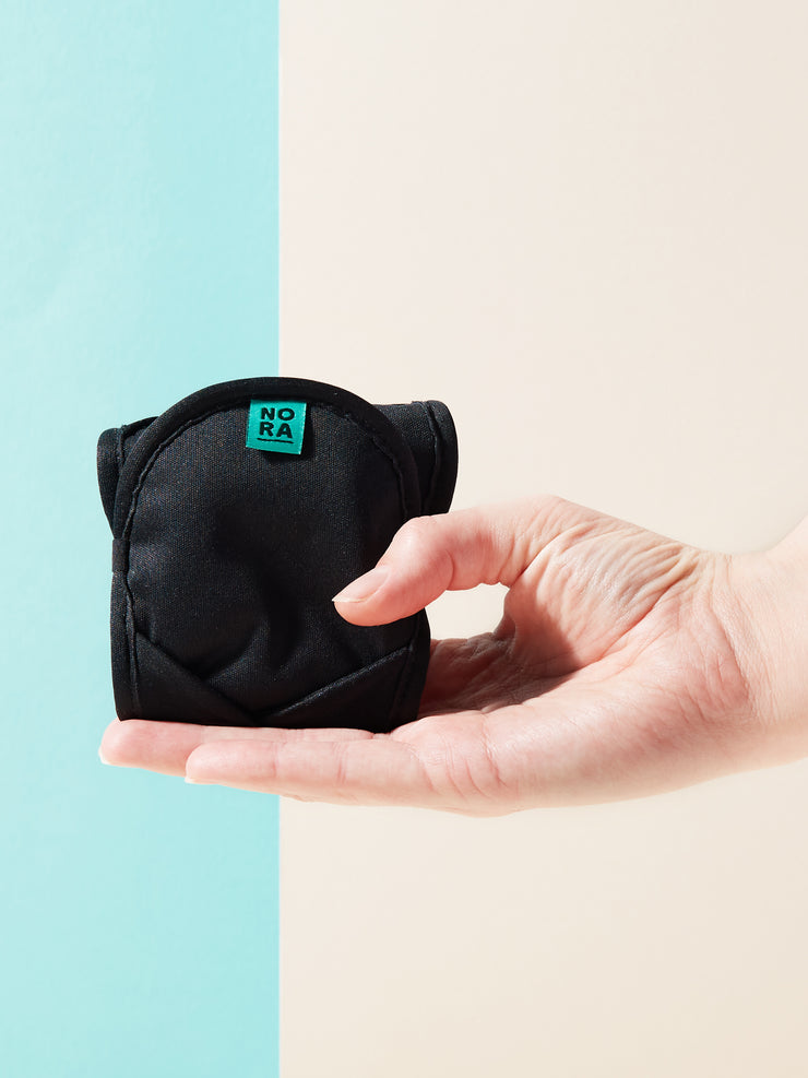 Moderate black pad folded in hand